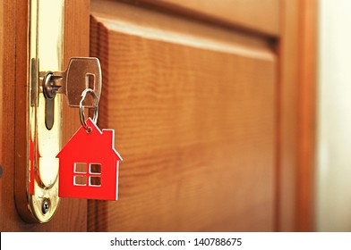 A Key In A Lock With House Icon On I