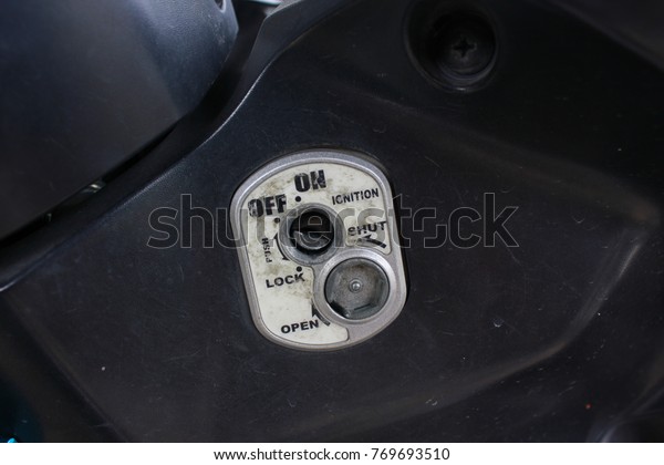 key lock securing access motorcycle ignition open\
close button