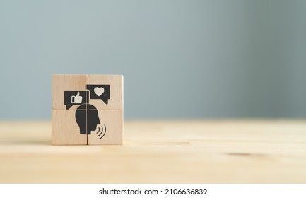 Key Opinion Leader (KOL) Marketing Concept. New Social Media Influencer Marketing In Digital Age. Hand Holds Wooden Cube With KOL Icon On The Wooden Table Grey Background And Copy Space. Banner.