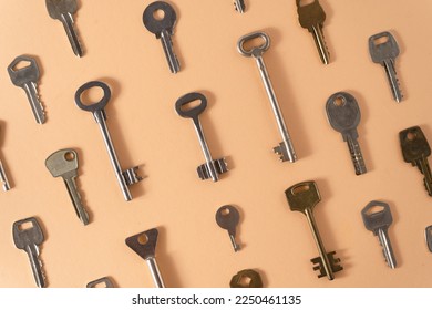 Key pattern. Background from different old keys. view from above. Door key in white and yellow metal.