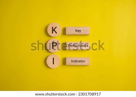 Key performance indicator, Businessman holding wooden cube with KPI