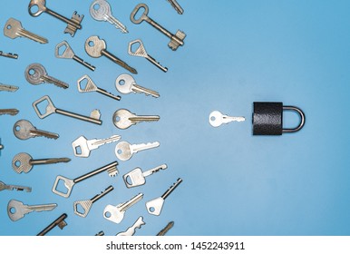 Key picking concept. Lock and different antique and new keys, blue background. Protection of business and house, real estate security.