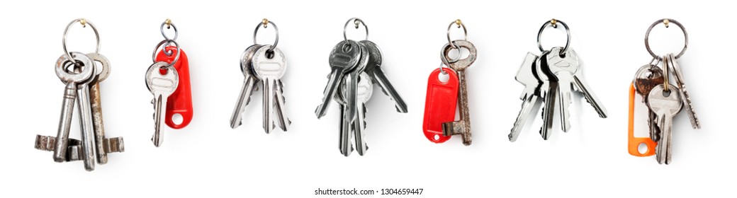 Key ring with house door keys collection isolated on white background. Banner design element security concept
