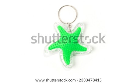 Key ring in a star shape isolated on a white background. High quality photo