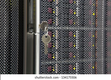 Key from server rack with multiple hard drives.