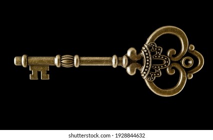 Key shapes making a abstract background using bronze antique keys layed black background showing ruff cut keys and abstract shapes