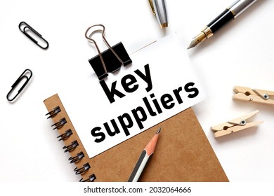 Key Suppliers, The Inscription On The Business Card Is Attached To The Notebook.