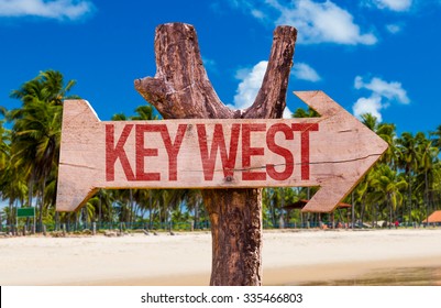 Key West Arrow With Beach Background