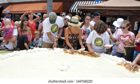 KEY WEST, FL-JULY 4th:  Pieces Of The Largest Key Lime Pie In The World Are Handed Out To Tourists And Locals Alike On July 4, 2013, In Key West, Florida, At The First Annual Key Lime Pie Festival.