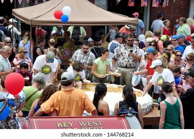 KEY WEST, FL-JULY4th:  Pieces Of The Largest Key Lime Pie In The World Are Handed Out To Tourists And Locals Alike On July 4, 2013, In Key West, Florida, At The First Annual Key Lime Pie Festival.