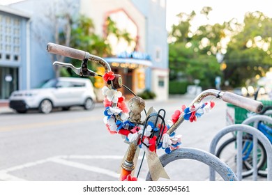 Key West, Florida Downtown Street Road With Fake Flowers On Bicycle, Cruiser Bike Parked By Rack In Summer