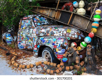 KEY WEST, FLORIDA, USA - 08 October, 2014: Old Car Covered With A Variety Of Stickers At Bo's Fish Wagon Restaurant In Key West, Florida, USA On 08 October, 2014.