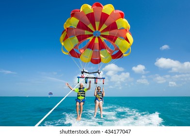 KEY WEST, FLORIDA, USA - MAY 02, 2016: An elderly couple is para sailing with a rope pulled by a boat near Key West in Florida