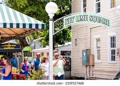 Key West, USA - May 1, 2018: People On Duval Street By Famous Key Lime Square For Famous Food As Tourist Attraction In Florida Keys City Town On Sunny Summer Day