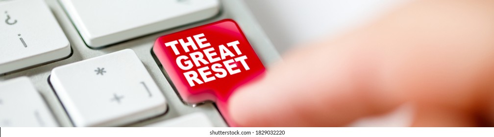 Keyboard Button Pressed By A Finger Representing The Great Reset Concept