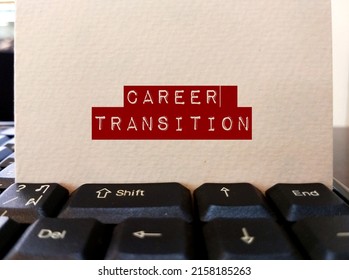 Keyboard with card paper written CAREER TRANSITION, means changing jobs or being relocated or jumping into a new career, need to overcome fear and get out of comfort zone