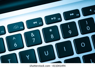 Keyboard close up in blue tone