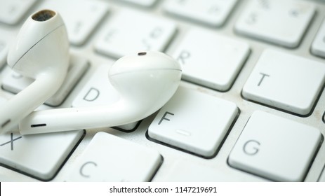 Keyboard of a computer and earphone close up