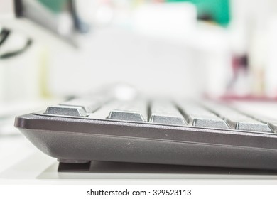 The keyboard of a computer on the desk.