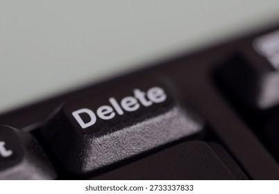Keyboard Delete key in focus, representing digital editing and control functions.