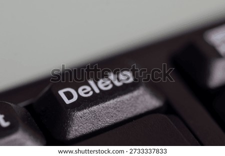 Keyboard Delete key in focus, representing digital editing and control functions.