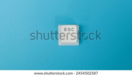 Keyboard Esc button on blue background