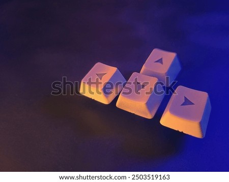 Keyboard keys on a black background in neon light. Competitive video games.