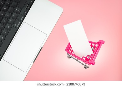 Keyboard laptop cart sale online shopping trolley cart with blank label card mockup. Laptop shopping cart with blank paper tag label white blank paper on pink background. Laptop pink shopping concept - Powered by Shutterstock