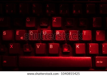 Keyboard with missing letters, the word security in center, virus, hackerattack, red warning, security hole