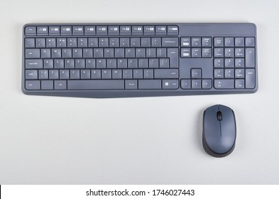 Keyboard And Mouse On Grey Background. Flat Lay, Overhead View Image. Copy Space, Template.