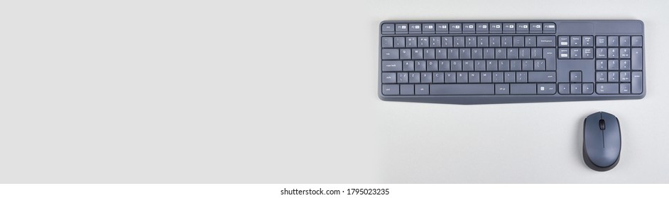 Keyboard And Mouse On Grey Background. Flat Lay, Overhead View Image. Copy Space, Template.