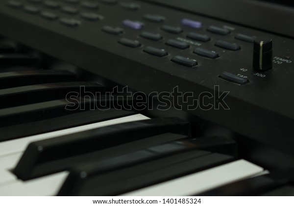 Keyboard music\
instrument, bokeh\
background