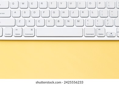 Keyboard on a yellow background.