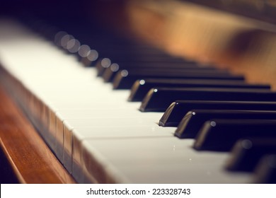 Keyboard of piano. Selective focus image. Warm color toned music background