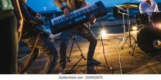 Keyboard Player Playing With The Band On The Stage.