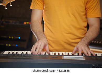 keyboard player is working in studio