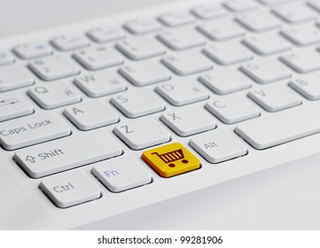 keyboard with yellow  shopping button - Shutterstock ID 99281906