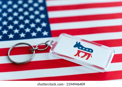 Keychain With An Image Democrat Donkey And The American Flag. In The USA Politics The Donkey Is The Symbol Of The Democrats, The Party That Represents Liberal And Progressive Views