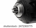 keyless chuck in a drill screwdriver with spindle lock, white background, isolate. Power tools. Copy space for text