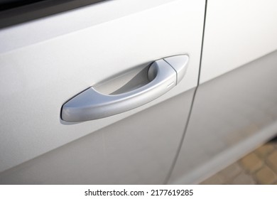 Keyless entry car door handle with keyless go touch sensor. Car door handle. Access button. Automatic opening of a car door without a key. Exterior design of a new electric luxury car.