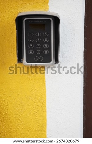 Keypad entry system mounted on a colorful wall