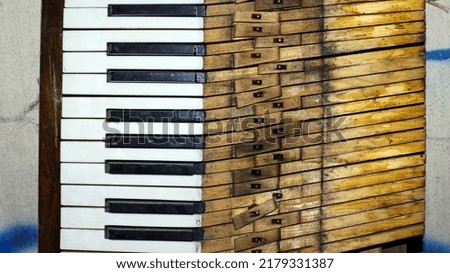keys. black and white keys of an old piano. details of a musical instrument. close-up. disassembled, broken keyboard instrument, piano or grand piano, wood parts. vintage, retro. view from above