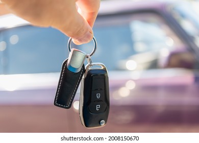 Keys and car in the background. Sale, purchase of a car. - Shutterstock ID 2008150670