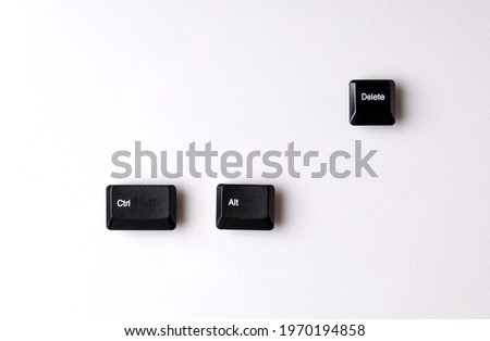 Keys Ctrl, alt, delete laid out separately on a white background