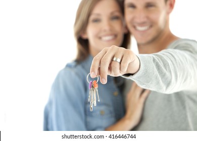Keys in hands of a happy couple - selective focus