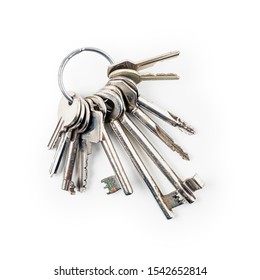 Keys on key ring arrangement isolated on white background clipping path included. Design element, top view, flat lay. Security concept