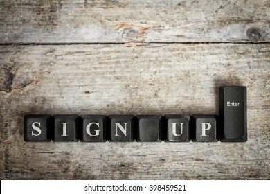 Keys On A Wooden Table With The Words Sign Up ,conceptual