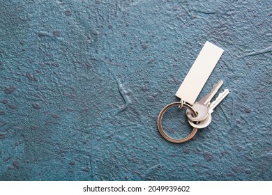 Keys with stylish keychain on dark background