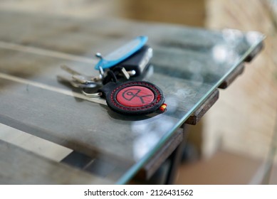                    Keys With The Symbol Of Almeria On A Glass Table. Andalusia, Andalusian Patio. Spain            