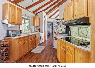 Keystone Heights, Florida USA - October 9, 2022: Uniquely Shaped Kitchen With A Stone Backsplash And Double Ovens